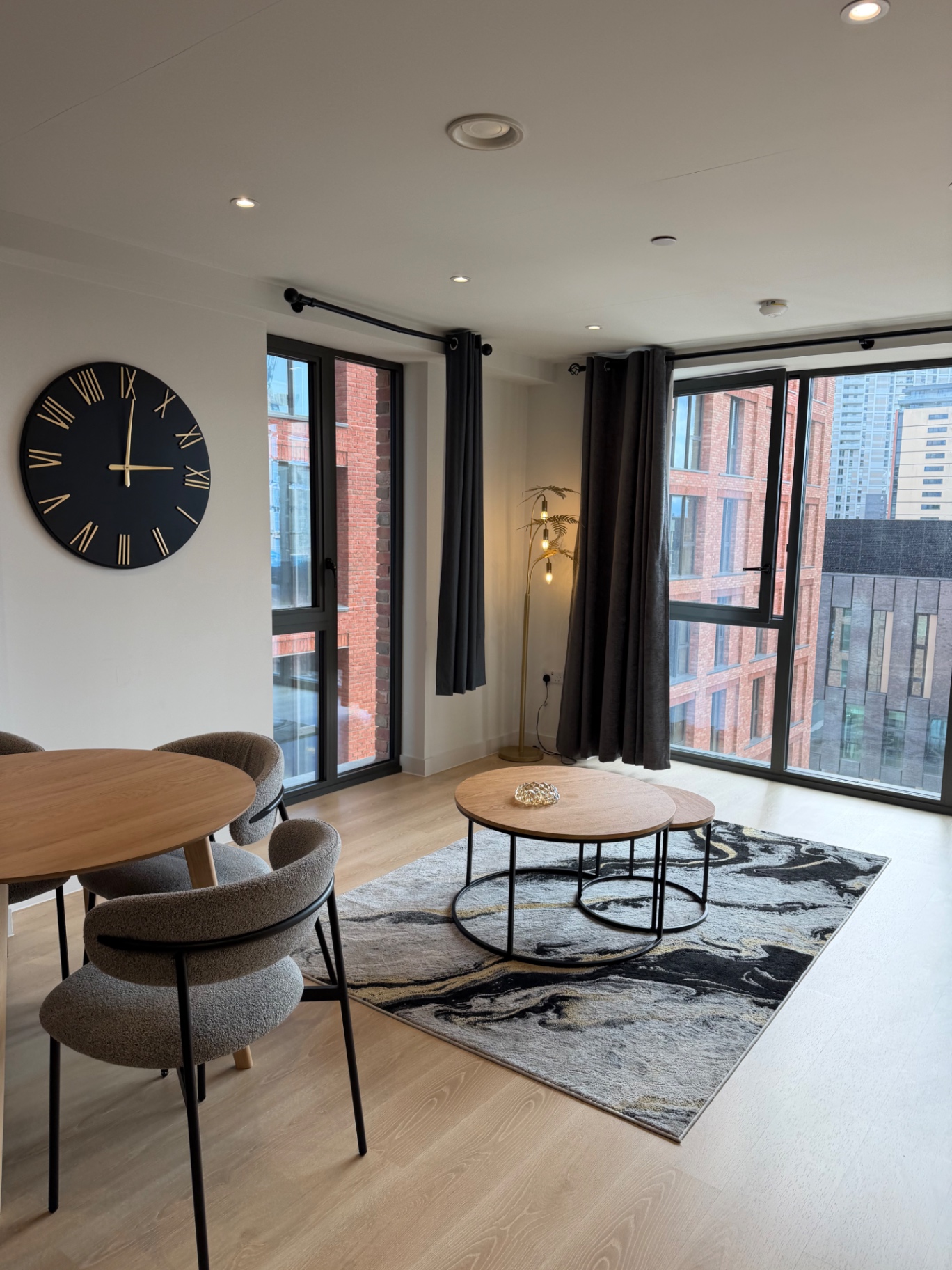 WaterHouse Gardens — dining and living area with floor-to-ceiling windows