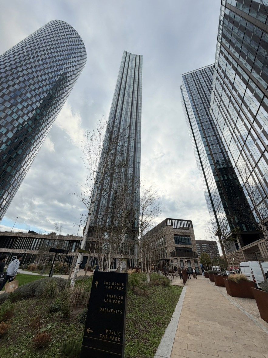 The Blade — Deansgate Square towers seen from the landscaped grounds