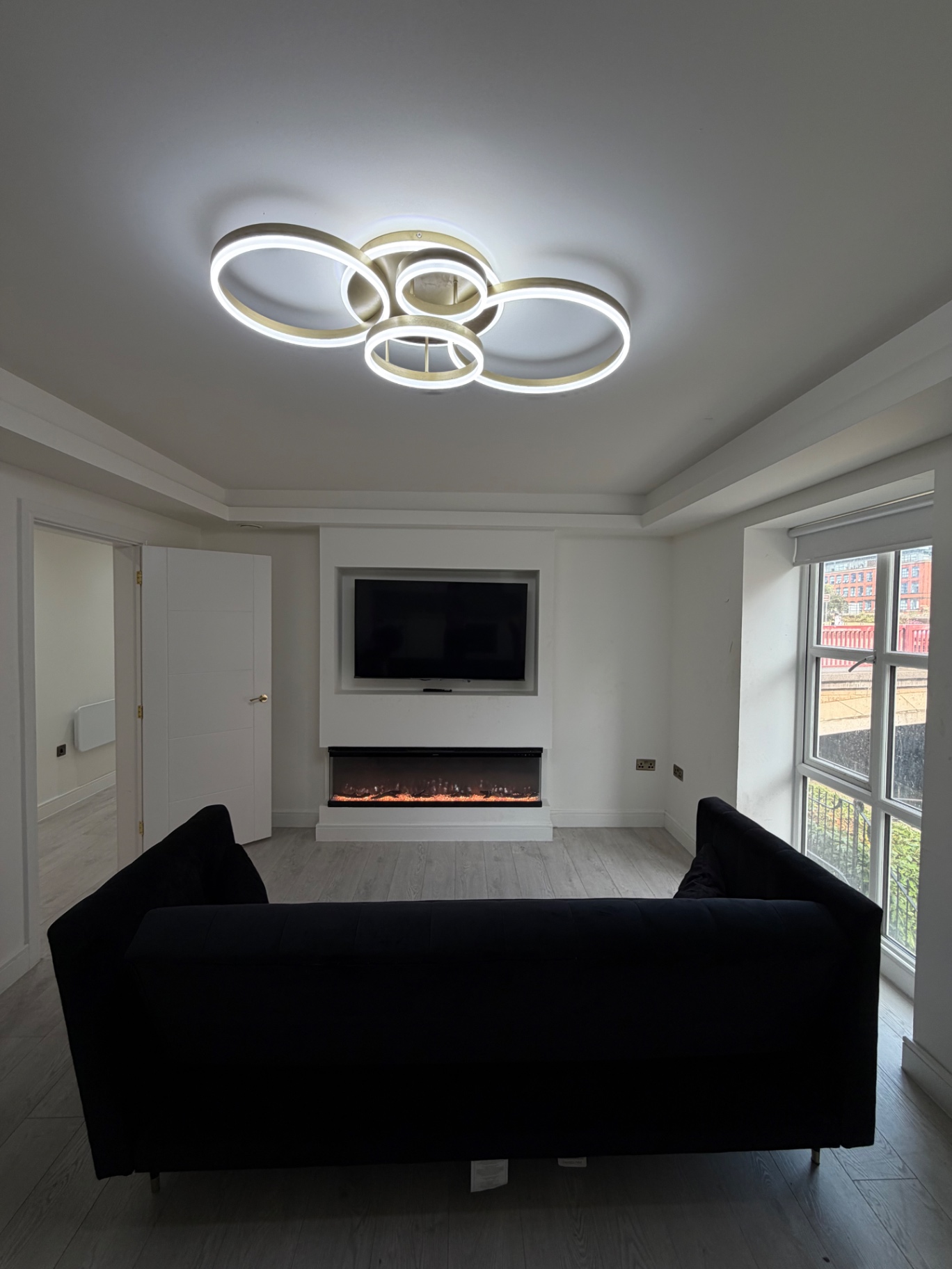 Outram House — living room with sofa and canal view